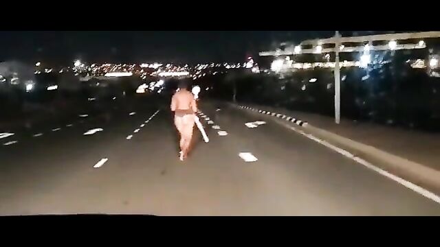 Another Naked Mad African Woman With Big Ass Caught In Public In South Africa, Obstructing Night Traffic - 5 image