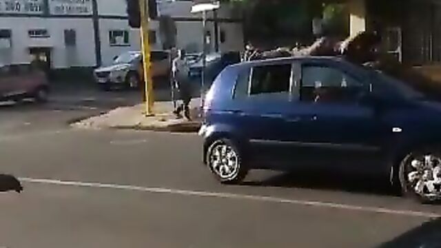 Naked Mad South African Woman With Big Ass Caught On A Car Roof In Public - 3 image