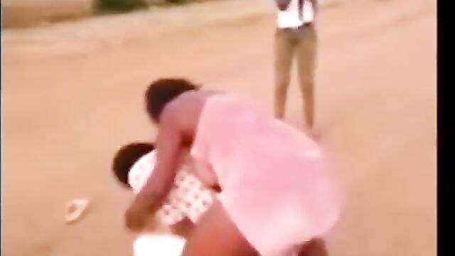 Breasts pop out as African wife beats sidechick in public for sleeping with her husband