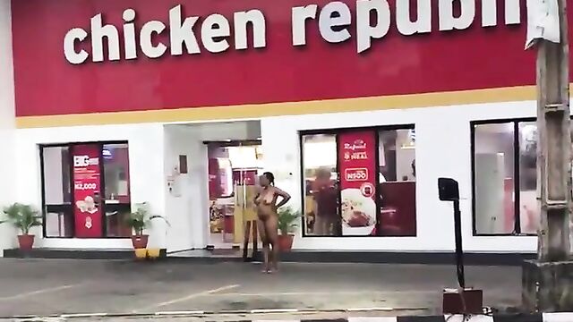 Naked Mad Woman Filmed Standing In Front Of Chicken Republic At Ilupeju, Lagos - 1 image