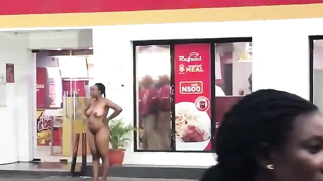 Naked Mad Woman Filmed Standing In Front Of Chicken Republic At Ilupeju, Lagos - 4 image