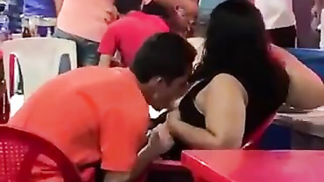 Man caught sucking his girlfriend’s breasts in public at a party! - 2 image