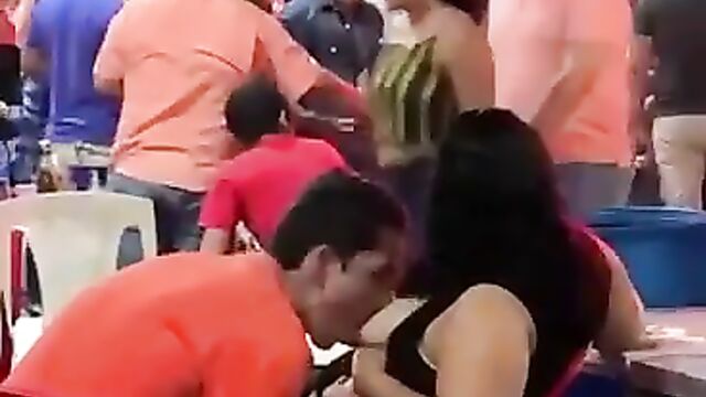 Man caught sucking his girlfriend’s breasts in public at a party! - 4 image