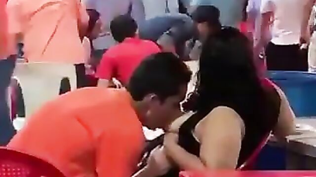 Man caught sucking his girlfriend’s breasts in public at a party! - 5 image