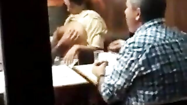 Man pressing girlfriend’s naked breasts in public in a restaurant - 1 image