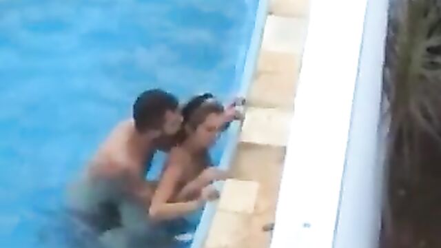 Discreet Sex In The Pool In Public - 1 image