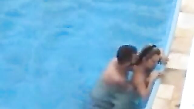 Discreet Sex In The Pool In Public - 3 image
