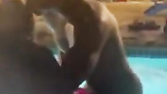 Horny couple caught having sex in a pool in public - 4 image