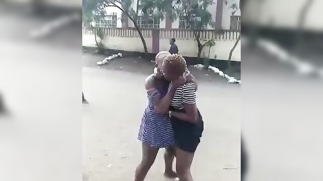 Two African sluts with big tits caught fighting in public, showing panties - 2 image