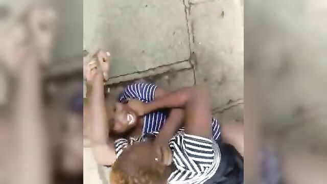 Two African sluts with big tits caught fighting in public, showing panties - 3 image