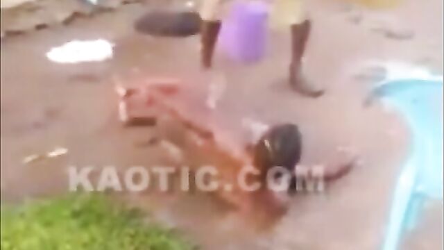 African man caught flogging naked & pregnant wife! - 1 image