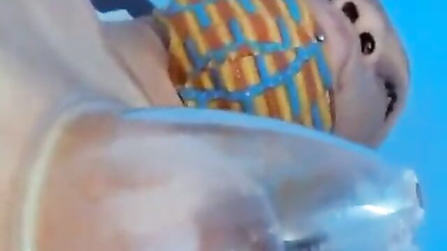 African girl caught pumping her breasts