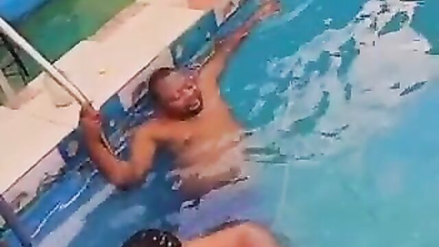 Naked African couple having sex in a pool in public - 1 image