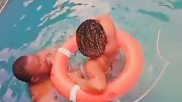 Naked African couple having sex in a pool in public - 3 image