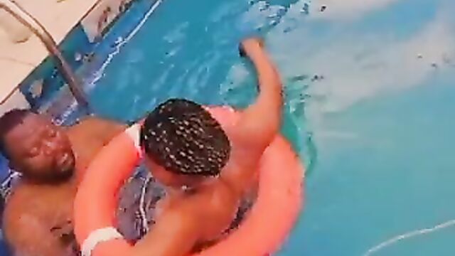 Naked African couple having sex in a pool in public - 4 image
