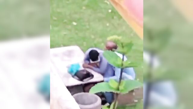 African couple caught having discreet sex in a public park - 1 image