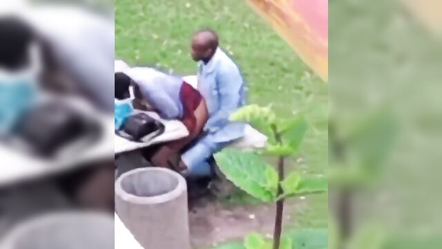 African couple caught having discreet sex in a public park - 2 image