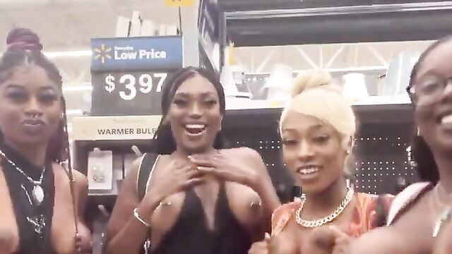 African girls showing their breasts in a store in public - 3 image