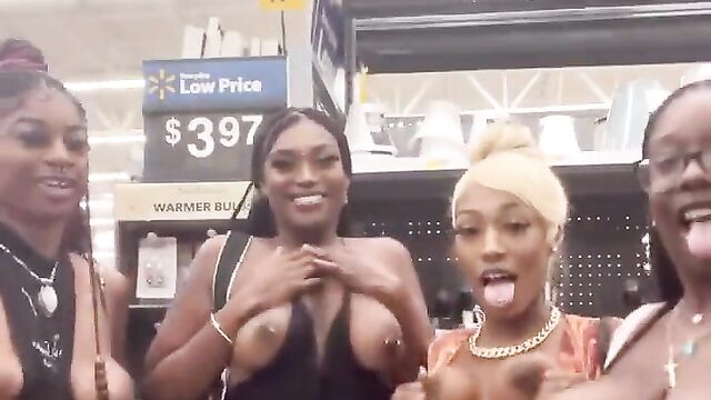 African girls showing their breasts in a store in public - 4 image