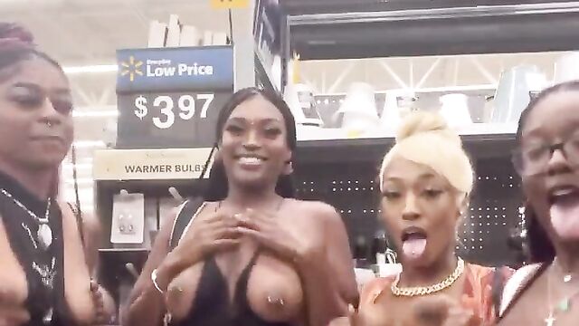 African girls showing their breasts in a store in public - 5 image