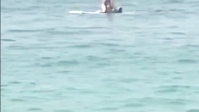 Naked couple caught having sex on a raft in public