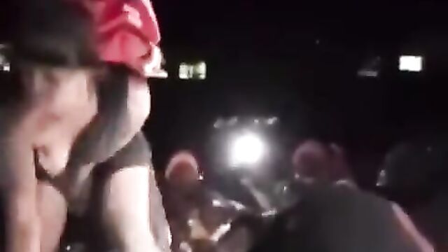 A thot showing breast at a club party - 5 image