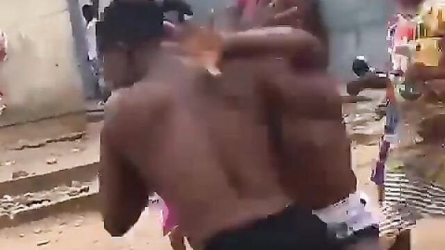 2 African ladies fighting, showing breasts - 1 image