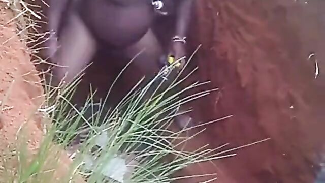 Naked native doctor performing rituals inside a grave - 1 image