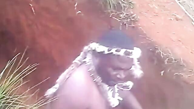 Naked native doctor performing rituals inside a grave - 3 image