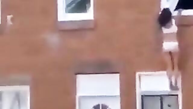 Side chick jumps off apartment window after angry wife caught her with her cheating husband - 1 image