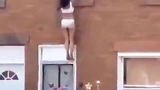 Side chick jumps off apartment window after angry wife caught her with her cheating husband