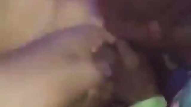 Guy sucking a naked stripper’s pussy in public at a Nigerian club party - 1 image