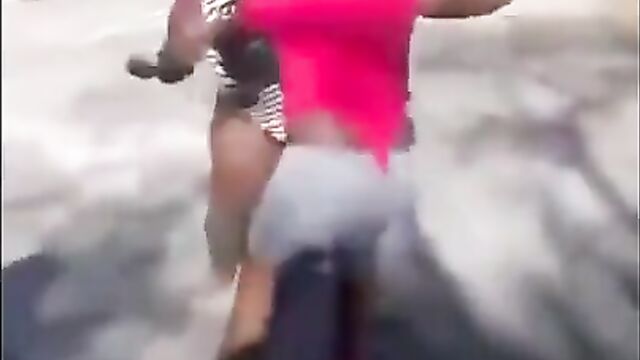 Boobs and ass pop out as big girls fight on the street - 1 image