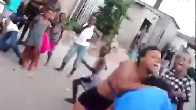 Boobs out as 2 ladies fight and strip themselves naked in public over a man - 4 image