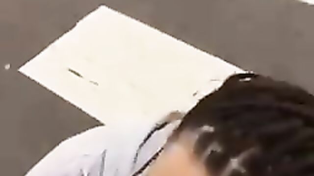 Crazy lady giving dude roadside head - 1 image
