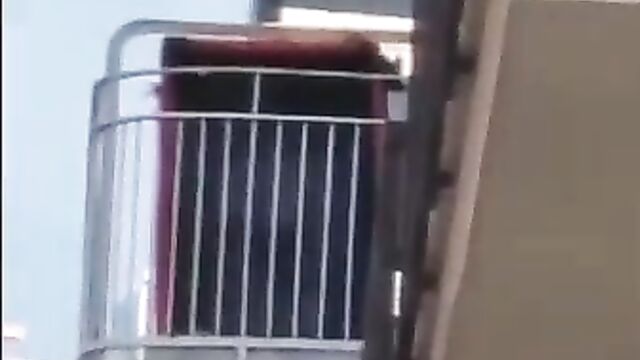 Bare breasts on the balcony - 1 image