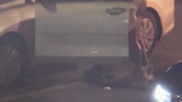 Man receiving head on the road in public