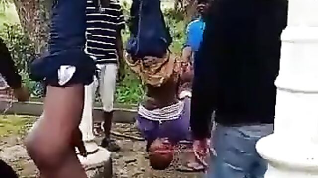 2 thieves stripped naked, hung upside down and beaten in public in South Africa - 5 image