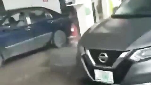 Naked woman seizes fuel pump and sprays petrol on customers in Nigerian petrol station