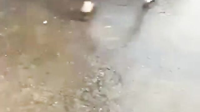 Naked woman seizes fuel pump and sprays petrol on customers in Nigerian petrol station - 4 image