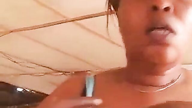 Ashawo sex worker shows her breast for less than $1 to a visitor at a brothel - 3 image