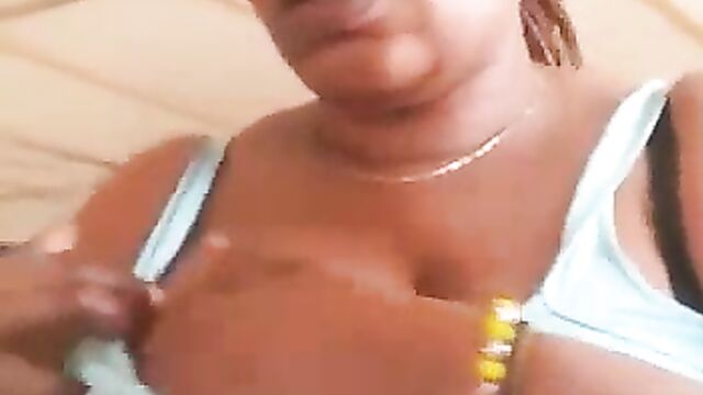 Ashawo sex worker shows her breast for less than $1 to a visitor at a brothel - 4 image