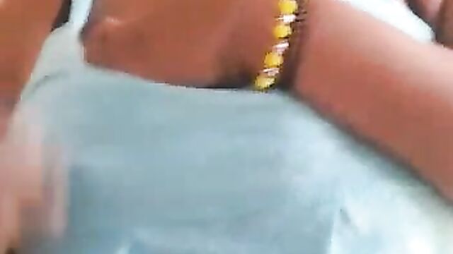 Ashawo sex worker shows her breast for less than $1 to a visitor at a brothel - 5 image