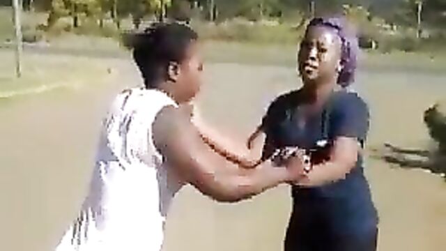 Girl strips her opponent and exposes her naked ass during fight - 1 image