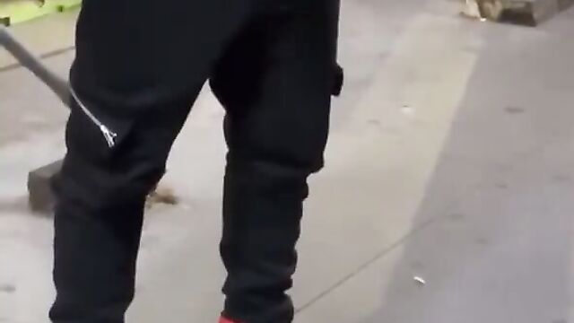 Crazy dude masturbates and pours his cum on sleeping homeless man in public! - 1 image