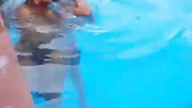 Guy caught squeezing girlfriend’s breasts in a pool – Part 1 - 3 image