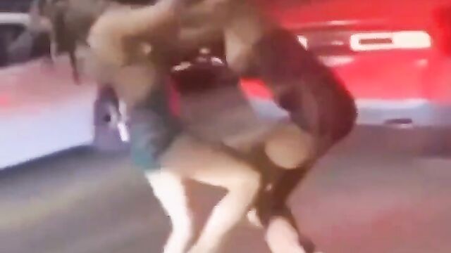 Ass and Boobs pop out in public as 2 ladies fight on the street over a rich man - 1 image