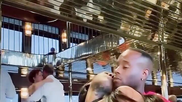 Boyfriend pressing girlfriend’s breasts in public in a hotel