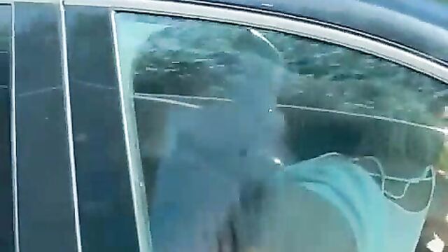 Couple caught having sex while driving in a car