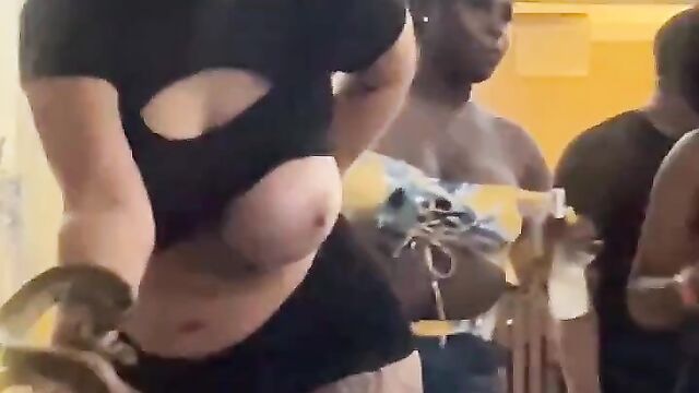 Boobs Out! Drunk woman caught wilding with a snake at a pool party